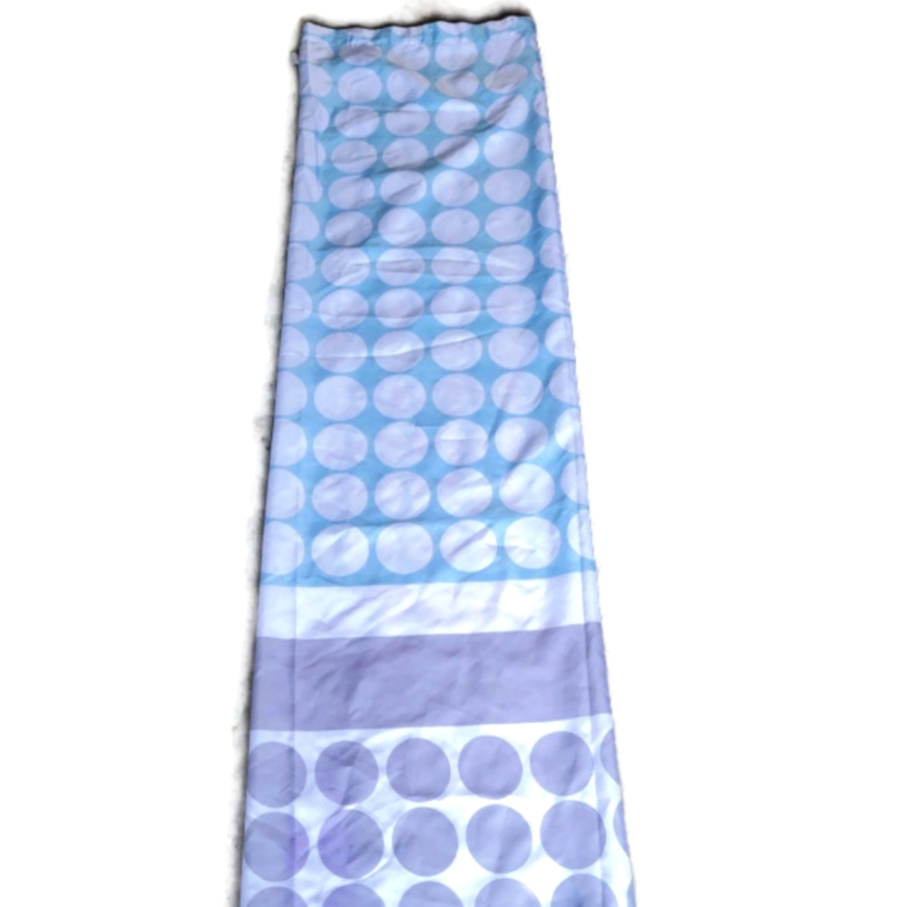 Folded shower curtain. Gray and greenish blue. Circle design.